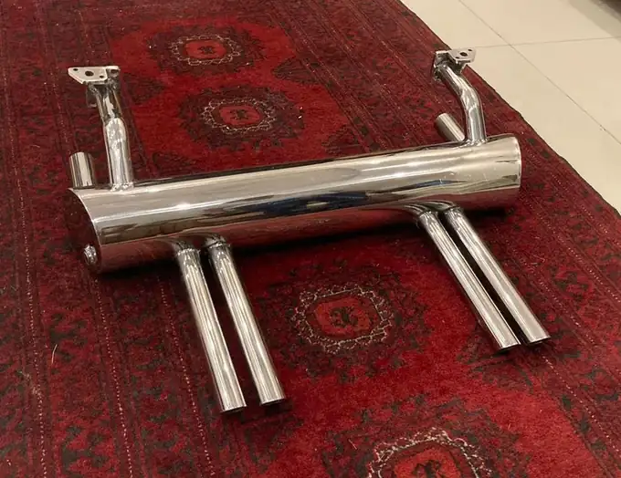 Abarth style exhaust and deck-lid rack hardware detail