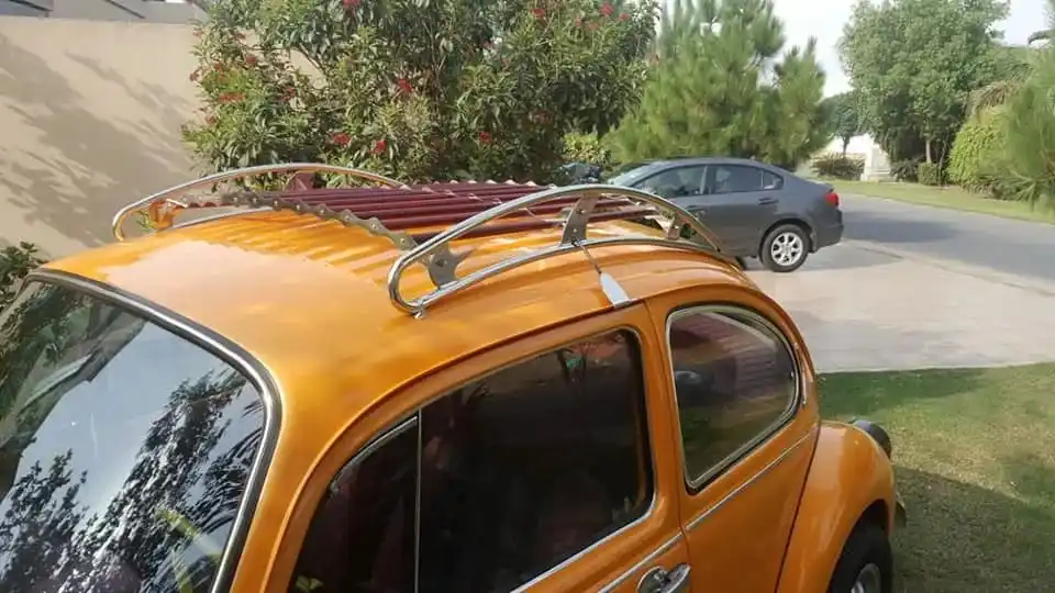 Orange VW Beetle roof rack install from above
