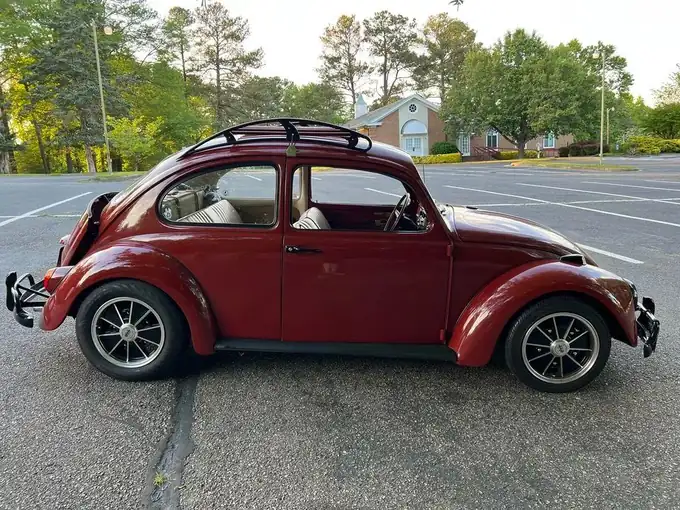 Red VW Beetle side profile with speed roof rack installed